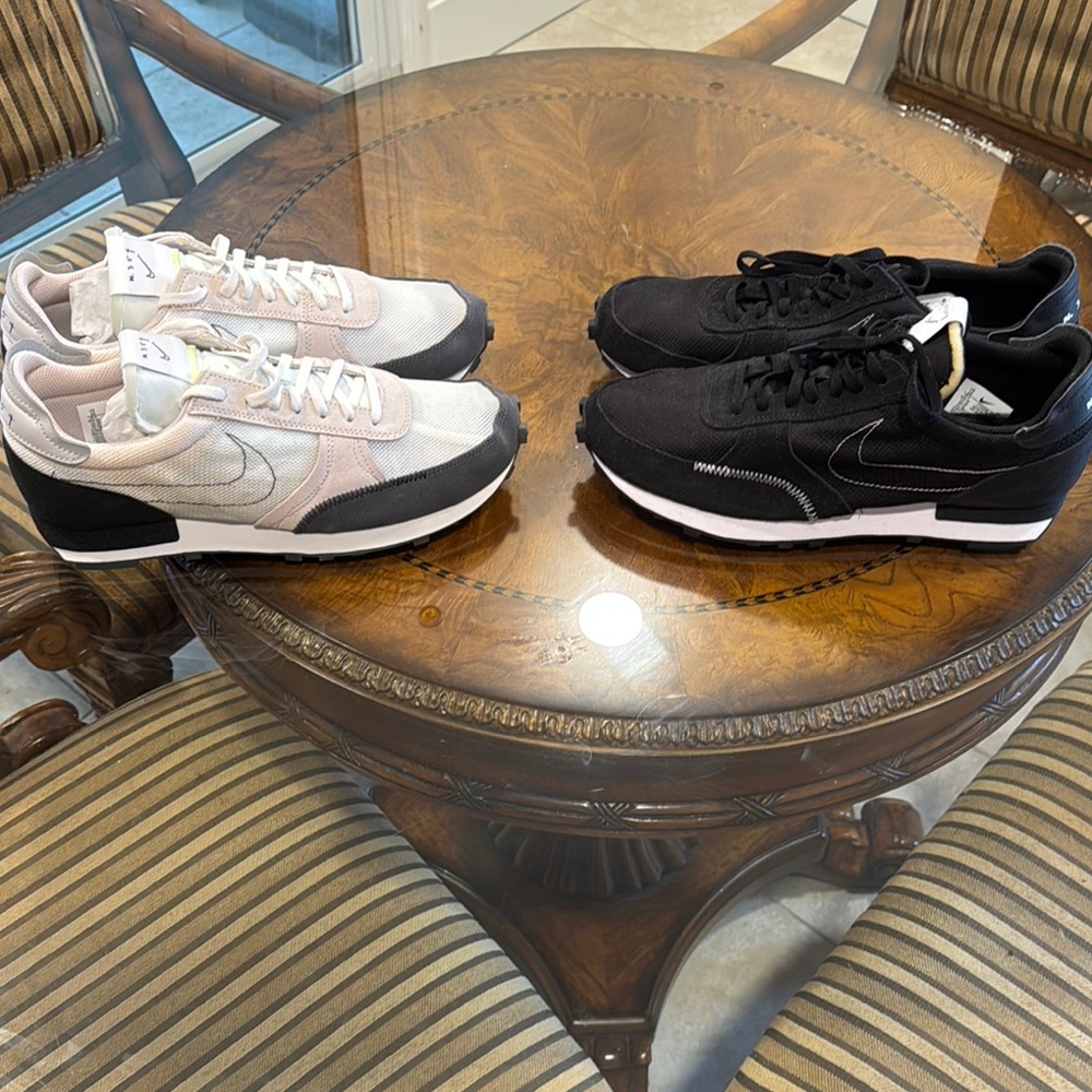 Two pair of brand new Nike means size 10 shoes